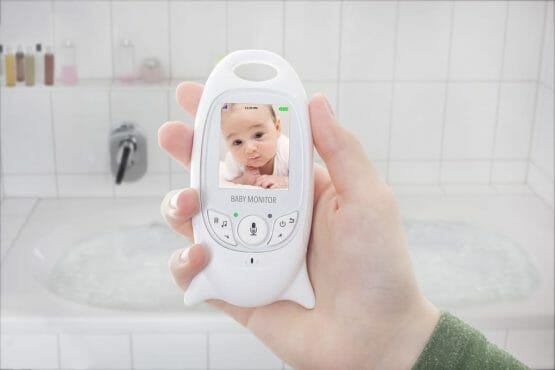 Mother checking baby through baby monitor when taking a bath Mother checking baby through baby monitor when taking a bath