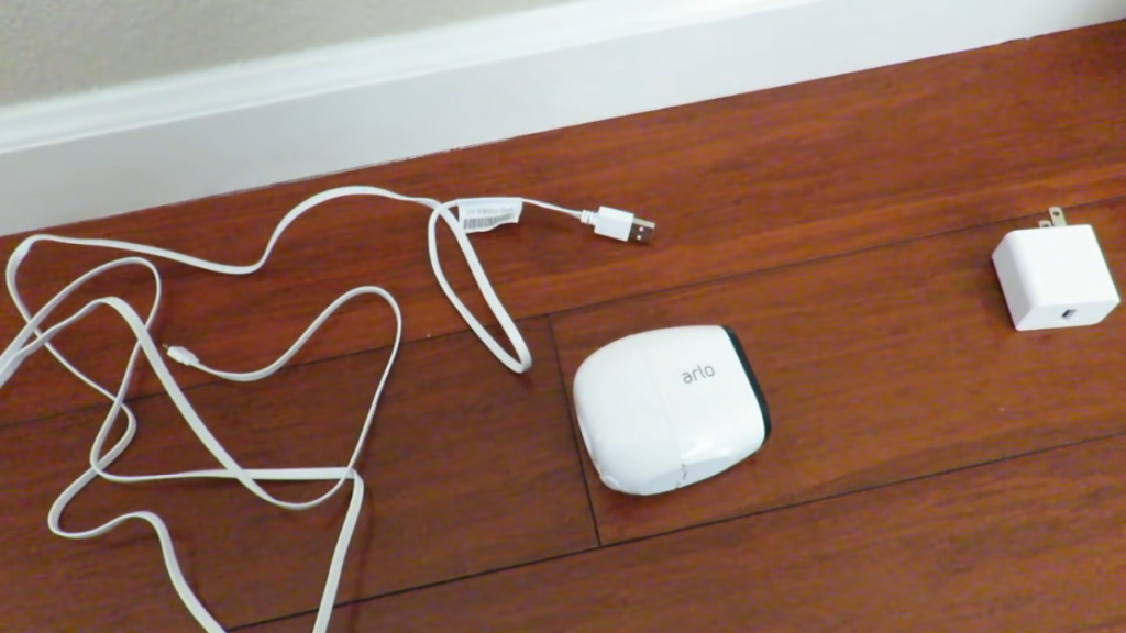 arlo with its wire and charger connector